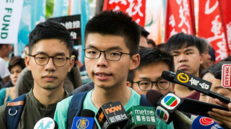 Joshua Wong leads 'anti-authoritarian' march in Hong Kong