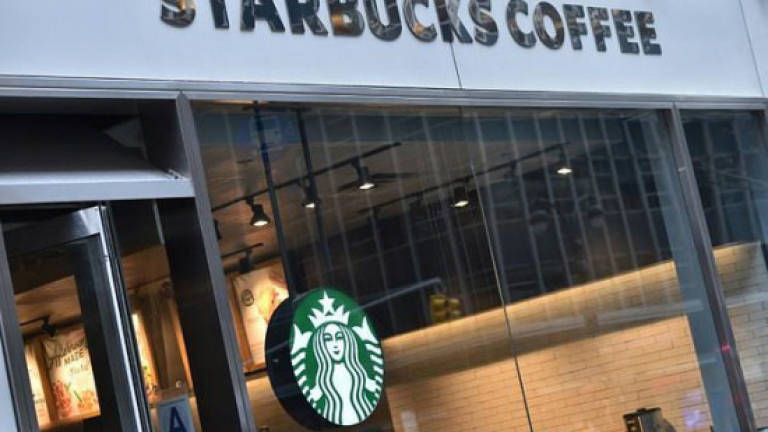 US police chief apologises after Starbucks arrests uproar
