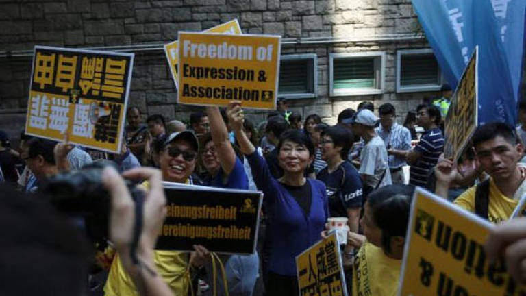 Hundreds protest in Hong Kong against attempt to ban pro-independence party