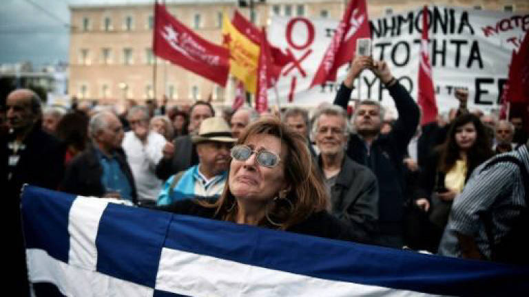 Greece demands debt relief from wary eurozone