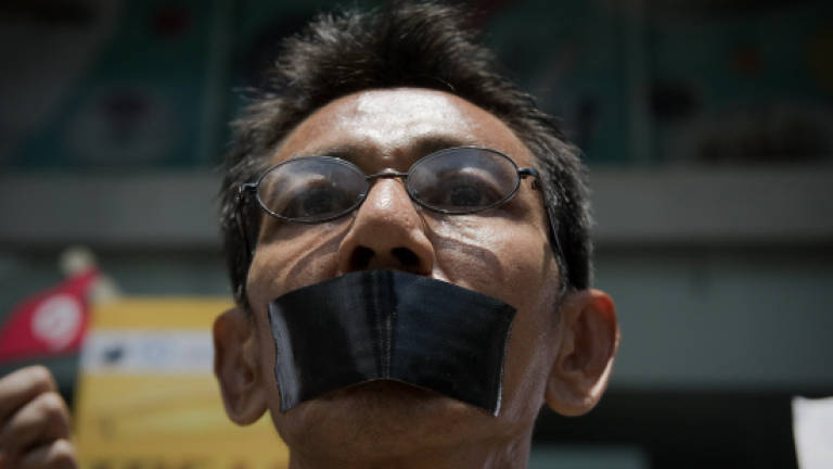 Thai anti-coup protesters defy junta ban with Bangkok march