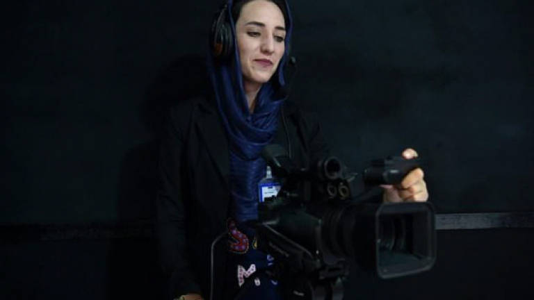 New magazine and TV channel give Afghan women a cautious voice