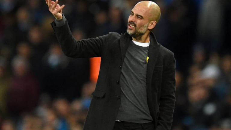 Guardiola critical of much-changed City despite making last eight