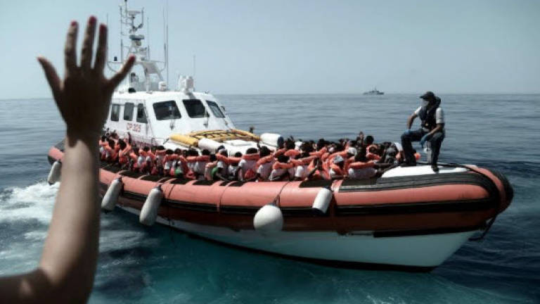 Bad weather forces rejected migrant ship's detour
