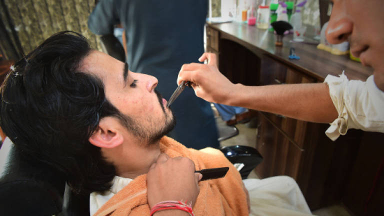 Barbers bristle at 'fashionable' beards in Pakistan province