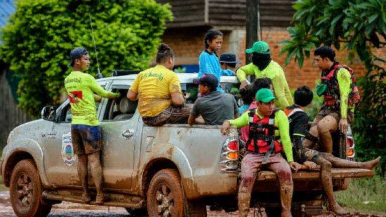 Thick mud hampers Laos dam rescue with hundreds still unaccounted for