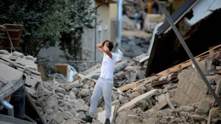 Italy mourns Amatrice, where quake wounds still weep