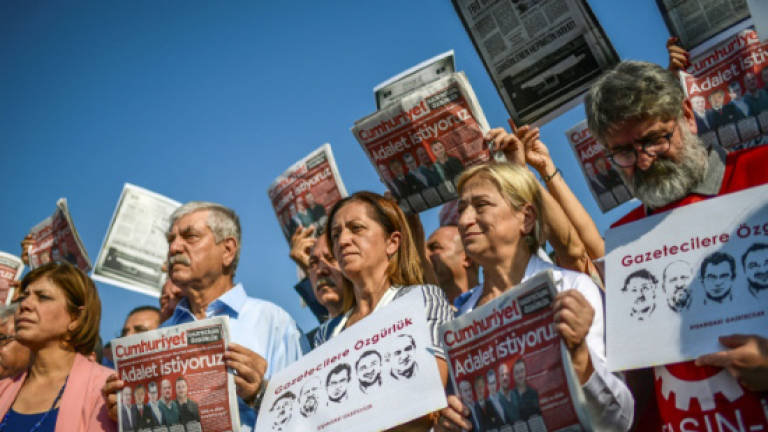 Turkey court keeps opposition newspaper staff in custody