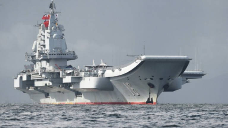 China's aircraft carrier sails by Taiwan as tensions rise