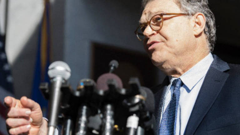 Democrats tell scandal-hit Franken to quit US Senate