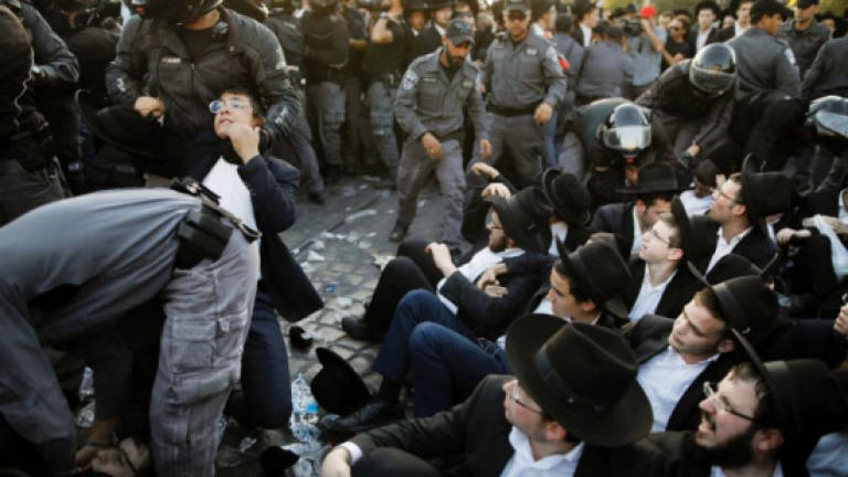 Israel arrests 35 as hardline Jews protest army service