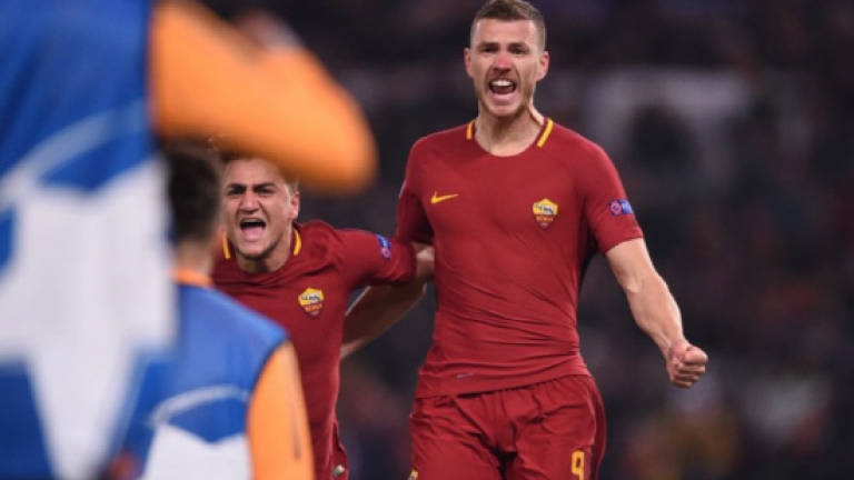 Dzeko strikes to take Roma into Champions League last eight