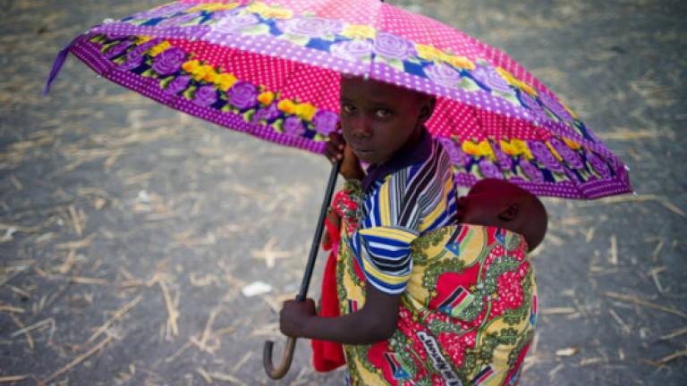 Barefoot and alone, children flee brutal S. Sudan war