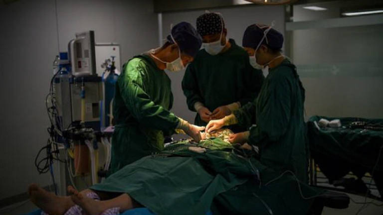 Going under the knife in China's plastic surgery stampede