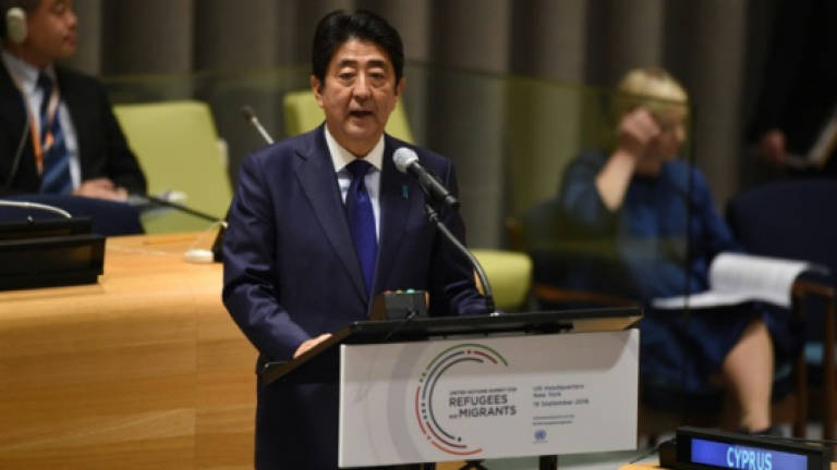 Japan backs off pregnancy clause for Syria refugees