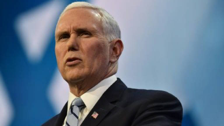 Pence blasts 'weak' immigration laws in speech at US-Mexico border