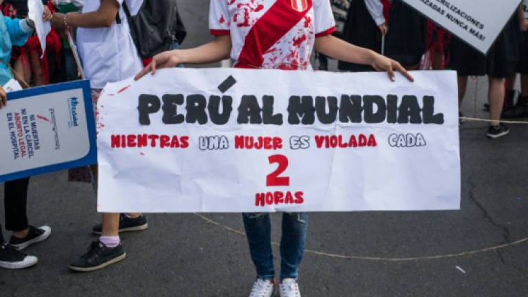 Thousands of Peruvians march against violence against women