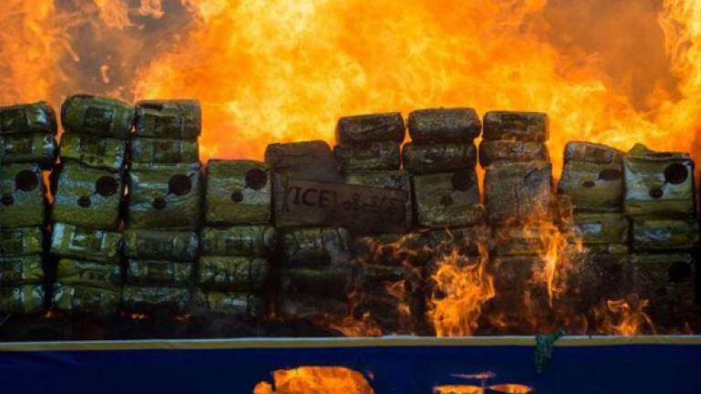 Laos torches narcotics stockpile on World Drug Day