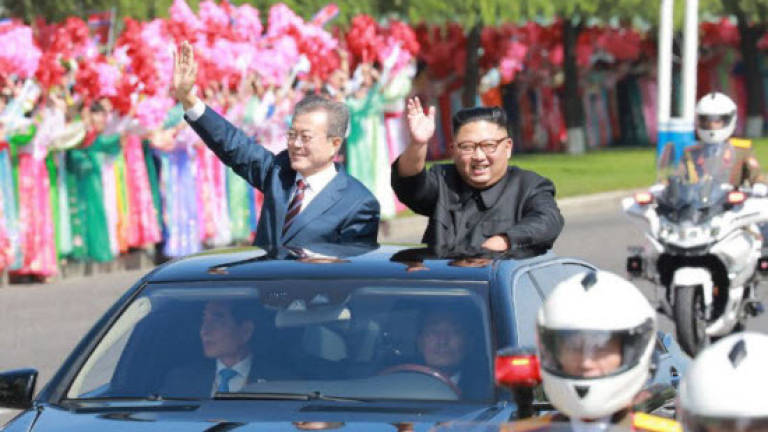 N. Korea's Kim to visit Seoul, shut missile site
