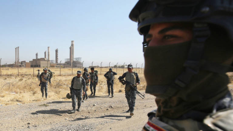 US-led coalition urges Baghdad, Kurds to avoid 'escalatory actions'