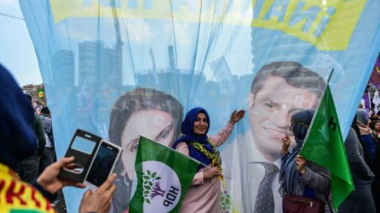 Year after arrests, Turkey pro-Kurd party weakened but defiant