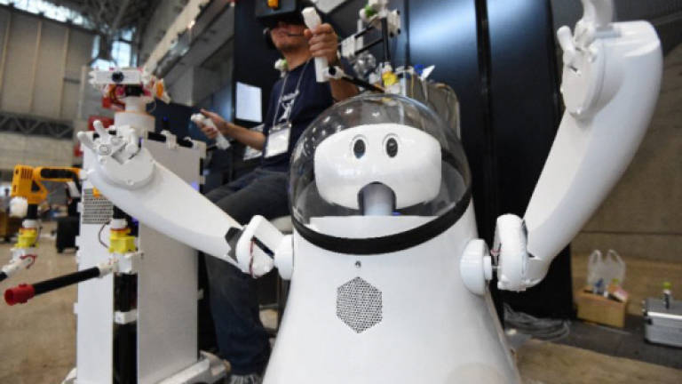Robots galore as Asia's biggest tech fair kicks off