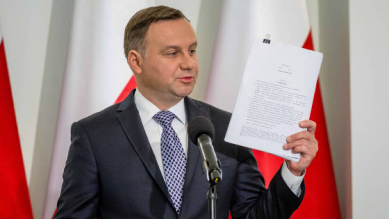 Polish president wants more powers over courts as controversy rages