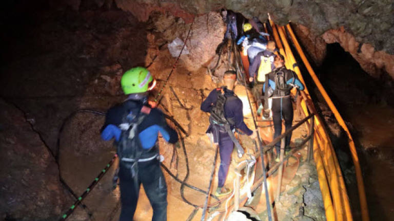 Thai boys were sedated and stretchered from cave in dramatic rescue