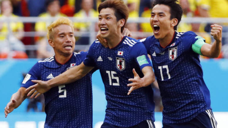 Japan make history with World Cup win against 10-man Colombia