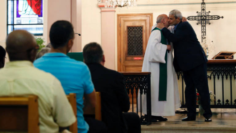 French Catholics, Muslims join in prayer to mourn priest (Updated)