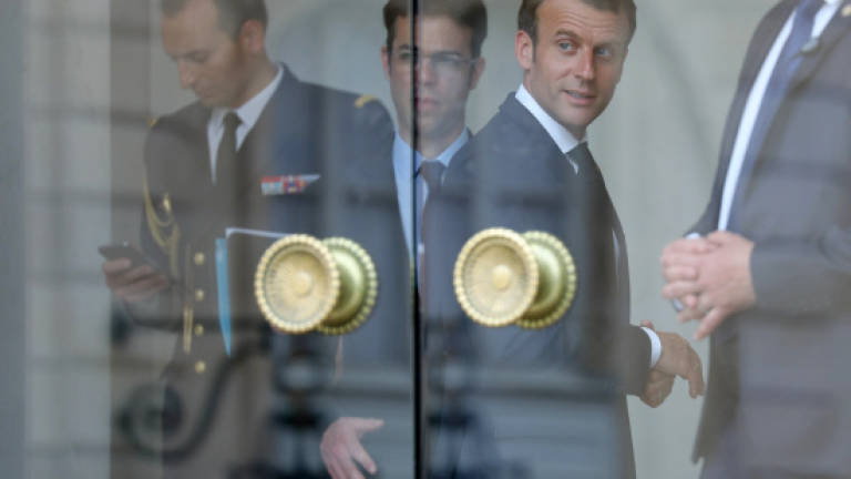 Macron's security aide charged over assaults caught on video