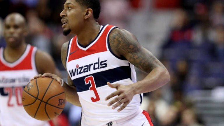 Wizards hold off revamped Cavs, Sixers edge Bulls