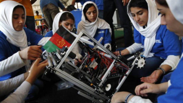'Happy' Afghan girls compete at robotics meet after US visa woes