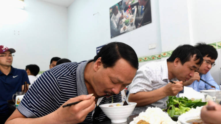 Eternal noodles: Obama 'bun cha' table encased in Vietnam
