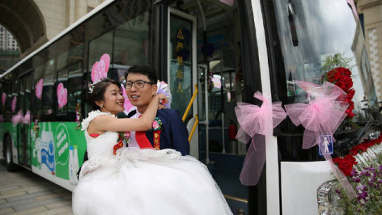 Bride drives groom to wedding in bus