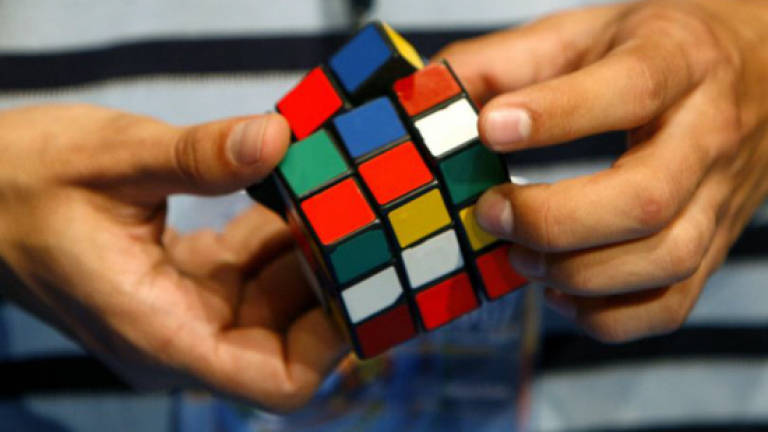 Creating art and cash out of Rubik's cubes