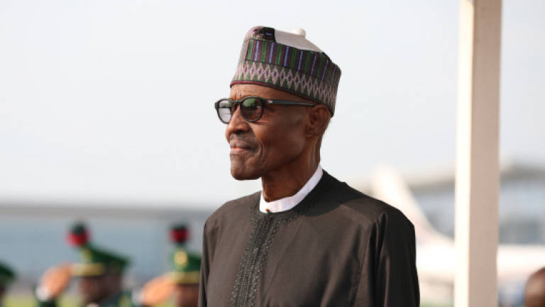 Nigeria's Buhari home after 100-day treatment in London
