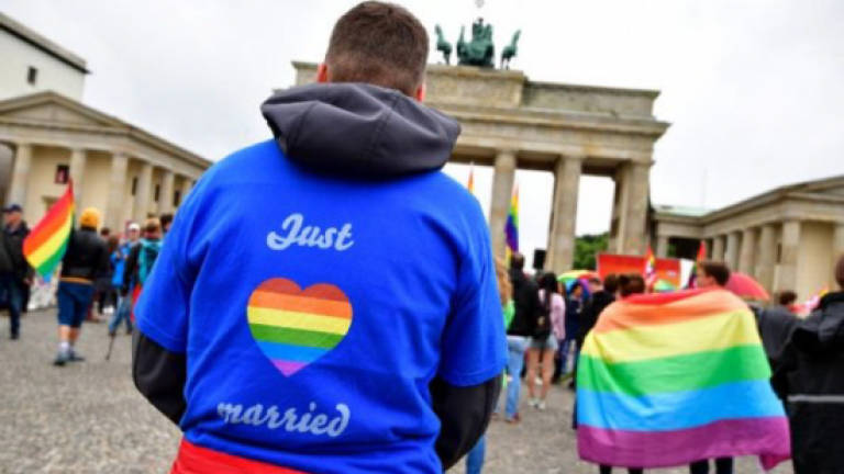 German gay couples tie knot after decades of struggle