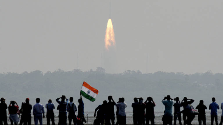 India shows off space prowess with launch of mega rocket