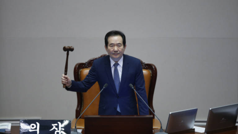 S. Korea parliament impeaches scandal hit president