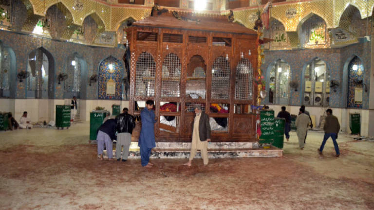 Islamic State-claimed bomb kills 70 at Pakistan shrine