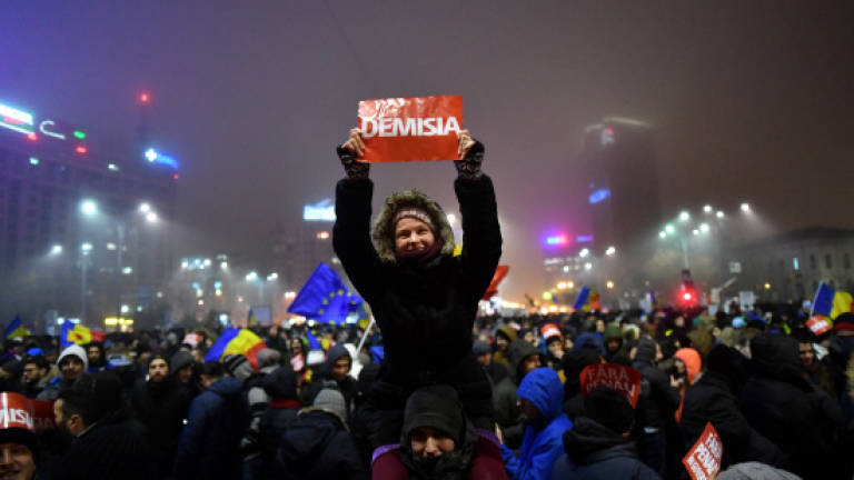 Romania government feels heat after record demos