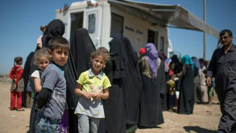 In Iraq's Mosul, mobile clinics deliver precious medical care