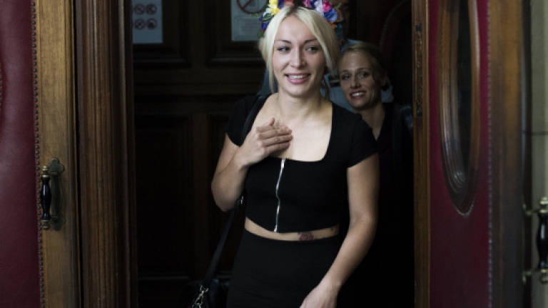 French court acquits Femen activists over topless cathedral stunt