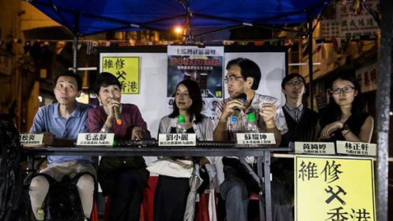 Ousted Hong Kong pro-democracy lawmaker barred from by-election
