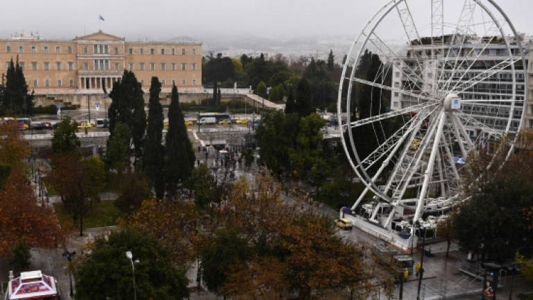 Heads roll in Athens over Ferris wheel that won't turn