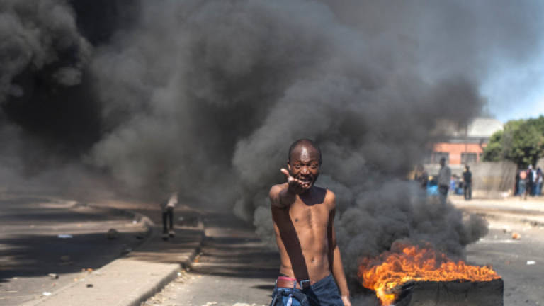 Zimbabwe accuses France and US of protest plot