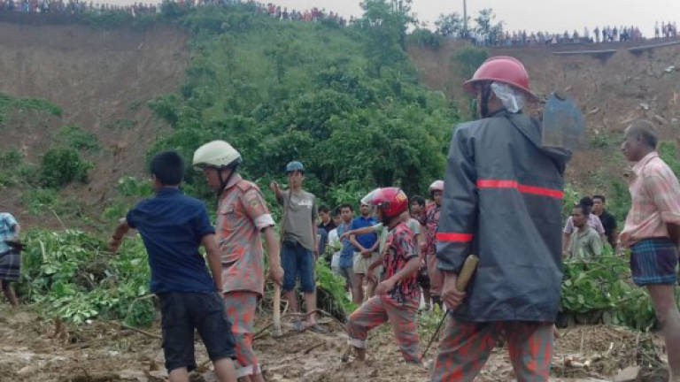 Rescuers battle to reach victims Bangladesh's deadliest landslides
