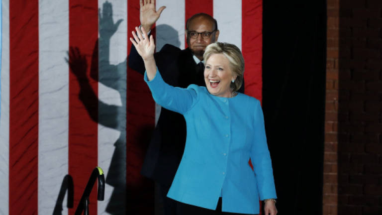 Clinton gets boost from FBI as tight White House race hits final day