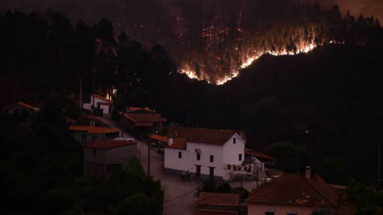 Portugal in mourning as firefighters still battle deadly wildfire